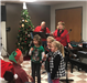 The band and kids singing carols