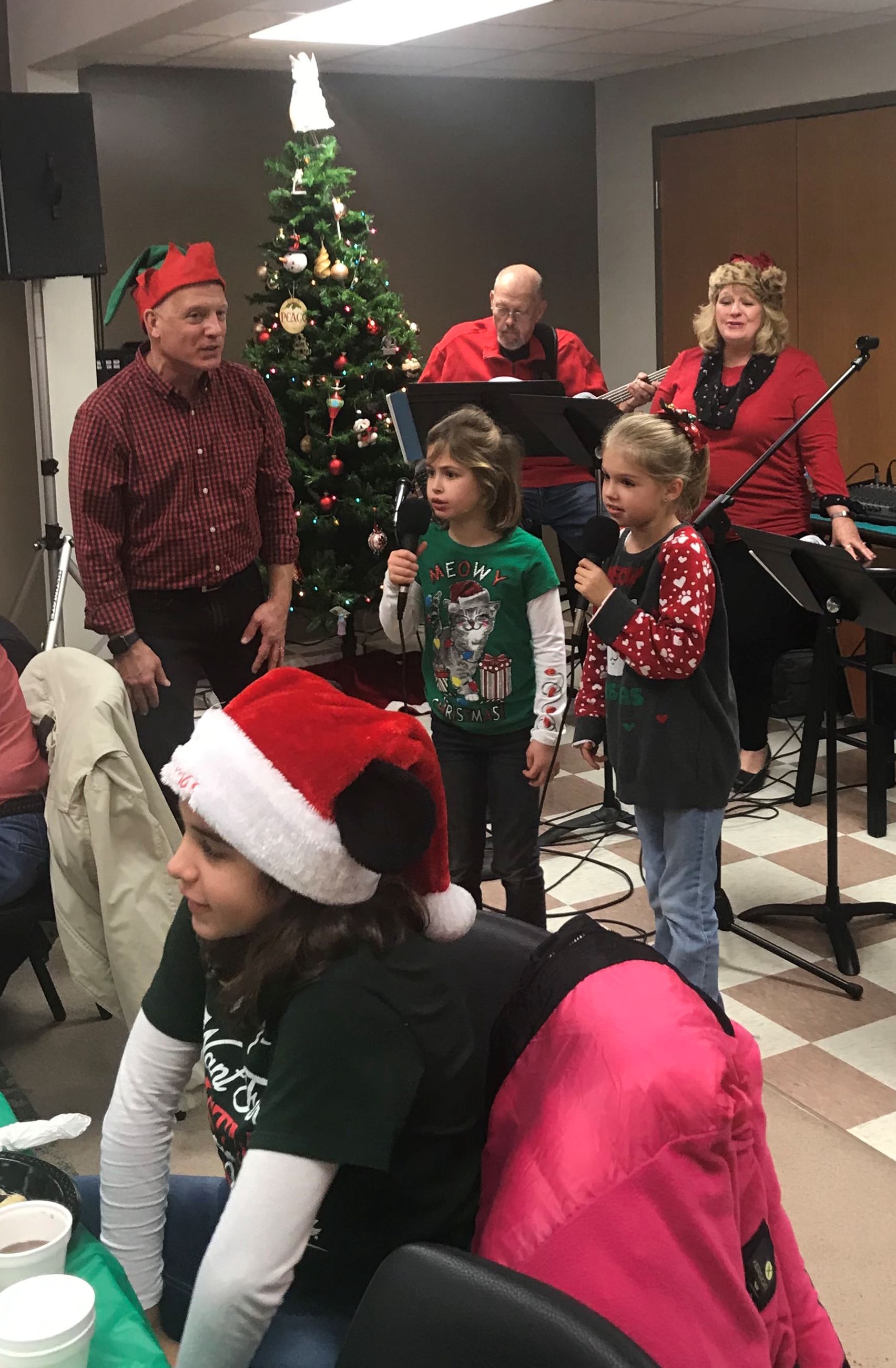 The band and kids singing carols